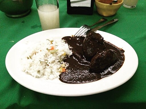Traditional Oaxacan mole negro served with rice